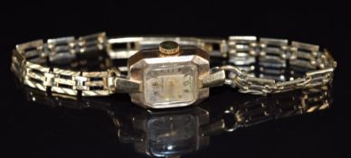 Summit 9ct gold ladies wristwatch with gold hands and hour markers, silver dial and 15 jewel