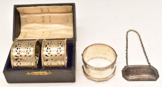 Cased pair of hallmarked silver napkin rings, further hallmarked silver napkin ring and a modern