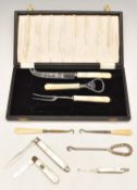 Hallmarked silver mother of pearl handled folding fork, fruit knife and button hook together with