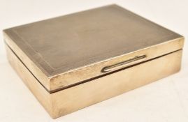 Elizabeth II hallmarked silver cigarette box with engine turned decoration, Birmingham 1959, maker S