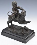 19thC bronze figure of a cherub riding a lion, raised on a marble plinth, H20.5cm