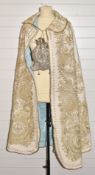 Late 19th/early 20thC wool cape with gold thread embroidered decoration, turquoise beads and silk