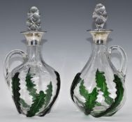 George V pair of hallmarked silver mounted clear and green glass ewers or claret jugs, Birmingham