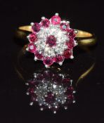 An 18ct gold ring set with diamonds and rubies in a cluster, 4g, size K