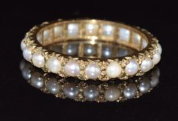 A 9ct gold eternity ring set with pearls, in vintage box, 2.2g, size N