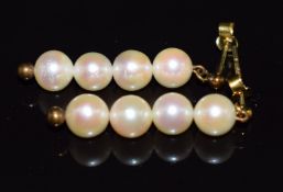 A pair of 9ct gold earrings set with four pearls to each