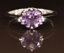 A 9ct gold ring set with a round cut amethyst, 2.2g, size N