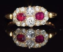 Victorian / Edwardian ring set with two cushion cut rubies and old cut diamonds, 2.5g, size M
