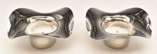 Pair of Georg Jensen stainless steel candle holders, diameter 10.5cm