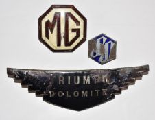 Three pre war enamel car badges comprising Triumph Dolomite, MG and SS (later Jaguar), length of