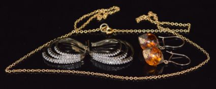 A pair of 9ct gold earrings set with diamonds, a 9ct gold chain (8g) and a pair of pressed amber