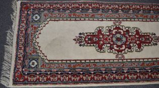 Runner rug with cream ground and blue and red border, 410 x 80cm