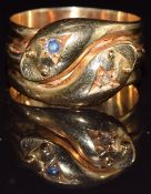 Edwardian 18ct gold double snake ring set with a sapphire and diamond, Chester 1905, 10.6g, size U