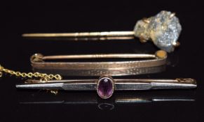 A 15ct gold and platinum brooch set with amethyst (3.7g), 9ct gold brooch (1.5g) and yellow metal
