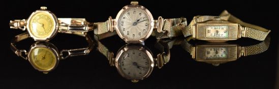 Two 9ct gold ladies wristwatches and a rectangular gold plated example, all on gold plated