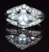 A 10k white gold ring set with white sapphires and aquamarines, 3.5g, size M/N