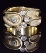 An 18ct gold bespoke ring set with five round cut diamonds,15g, size Q