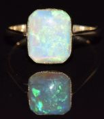 A c1910 gold ring set with a rectangular opal cabochon, in vintage box, 1.6g, size L