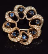 A 9ct gold brooch set with sapphires and seed pearls, 4.8g, 2.2cm