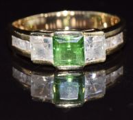 A 14k gold ring set with green and clear cubic zirconia, 6.7g, size 2