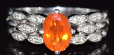 A 9k white gold ring set with a fire opal and diamonds, 3g, size R