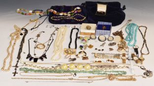 A collection of costume jewellery including brooches, beads, faux pearls, mother of pearl cross,