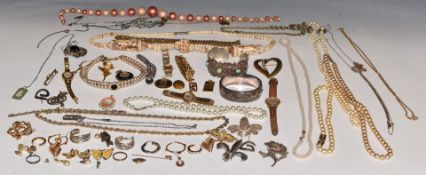 A collection of costume jewellery including some silver comprising filigree brooches, bangles,