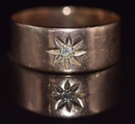 A 9ct rose gold ring set with a diamond in a star setting, Birmingham 1916, 3.1g, size P
