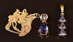 Two 9ct gold pendants set with tanzanites on 9ct gold chain, 2.1g