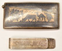 Niello curved silver card case with decoration of animals, length 8.5cm, together with a