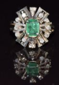 A white gold ring set with an emerald cut emerald and diamonds, 4.g, size G