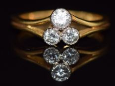 An 18ct gold ring set with three diamonds, 3.5g, size K