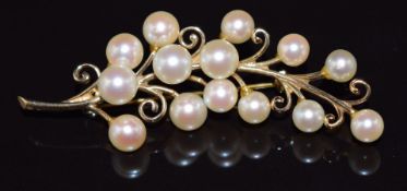 A 9ct gold brooch set with pearls, 8.5g, 5.8cm long