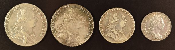 Two George III 1787 shillings, one with semee of hearts, together with a 1787 sixpence and a 1762