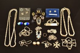 A collection of silver jewellery including chains, necklaces, earrings, etc