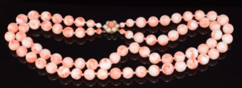 A double strand coral necklace, the 9ct gold clasp set with coral and pearls, 95.9g, 40cm long