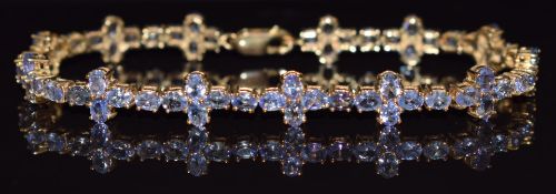 A 9ct gold bracelet set with tanzanites, 20cm long, 13.4g