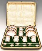 Aynsley porcelain cased set of six coffee cans decorated with roses in hallmarked silver holders