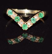 A 9ct gold V shaped ring set with emeralds and diamonds, 1.5g, size L