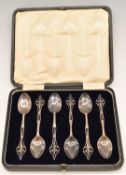 Cased set of George V hallmarked silver spoons with pierced thistle motif to tops, Sheffield 1918,