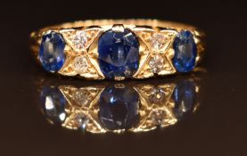 An 18ct gold ring set with sapphires and diamonds, Birmingham 1915, 3.1g, size L