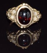 A 9ct gold ring set with a garnet cabochon, in vintage ring box, 2.8g, size J