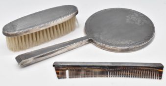 Modern hallmarked silver dressing table set comprising hand mirror, brush and comb, London 1979,
