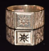 A 9ct gold signet ring set with a diamond in a star setting, with textured shoulders, 4.4g, size M