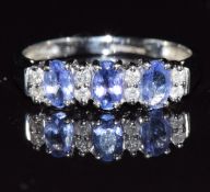 A 9ct white gold ring set with tanzanites and diamonds, 1.8g, size N
