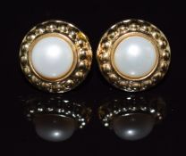 A pair of 9ct gold earrings set with a pearl to each, 2.5g