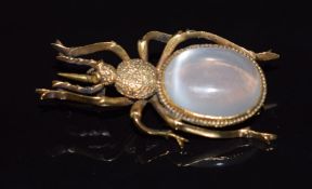 Victorian yellow metal brooch in the form of a beetle set with a foiled moonstone cabochon and