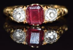 Victorian 18ct gold ring set with an emerald cut garnet and two old cut diamonds each measuring 0.