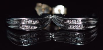 A pair of 14k white gold earrings set with diamonds, 2.6g