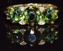 An 18ct gold ring set with tourmaline and diamonds, 3.5g, size M